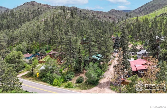 30 Falls Creek Dr, Bellvue, CO 80512 - view of mountain backdrop featuring a heavily wooded area