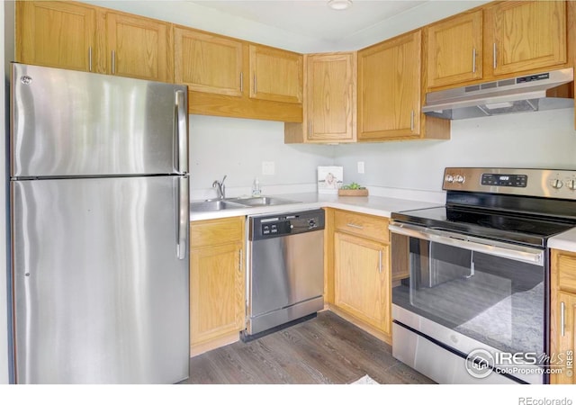 750 W Moorhead Cir Unit A, Boulder, CO 80305 - kitchen featuring appliances with stainless steel finishes, under cabinet range hood, dark wood-style floors, and light countertops