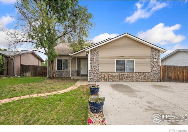 4740 Everglade Ct, Greeley, CO 80634 - mid-century modern home featuring stone siding