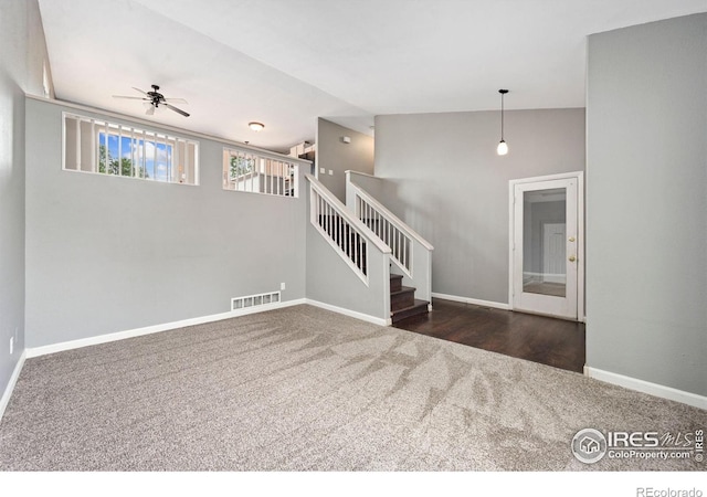 4740 Everglade Ct, Greeley, CO 80634 - unfurnished living room with carpet flooring, a ceiling fan, and stairs