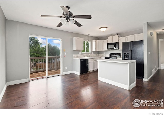 4740 Everglade Ct, Greeley, CO 80634 - kitchen featuring black appliances, light countertops, a ceiling fan, white cabinetry, and dark wood-type flooring