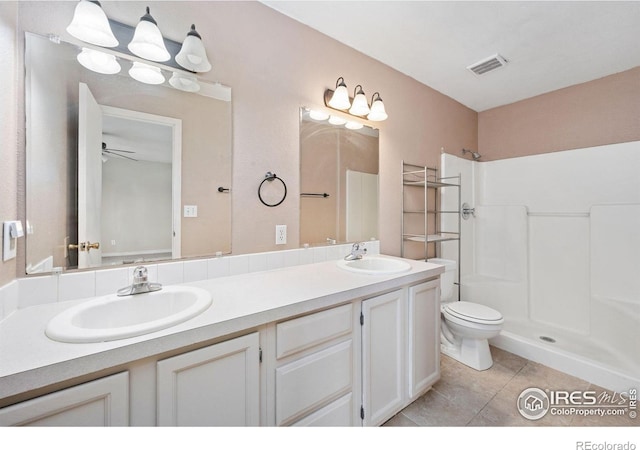 4740 Everglade Ct, Greeley, CO 80634 - bathroom featuring double vanity, tile patterned floors, a shower, and ceiling fan