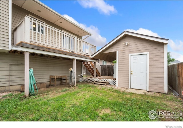 4740 Everglade Ct, Greeley, CO 80634 - back of house with a deck, a storage unit, and stairs