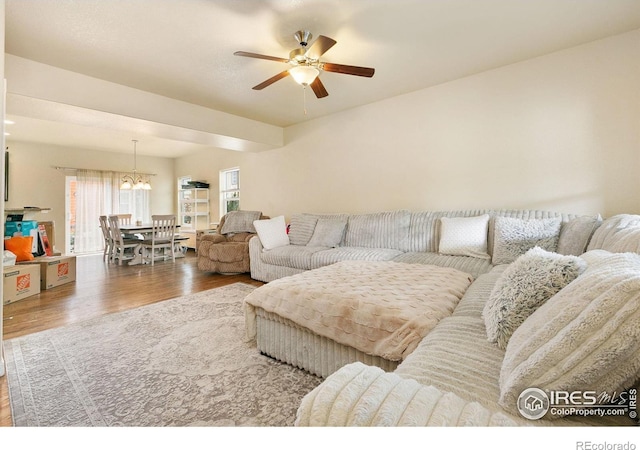 3001 Nebula Ct, Loveland, CO 80537 - living area with wood finished floors, ceiling fan, and a chandelier