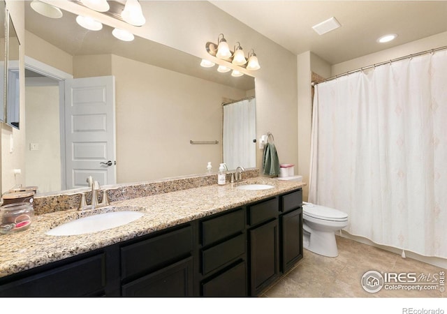 3001 Nebula Ct, Loveland, CO 80537 - bathroom with double vanity and tile patterned flooring