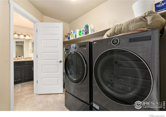 3001 Nebula Ct, Loveland, CO 80537 - laundry area featuring washer and dryer and light tile patterned floors