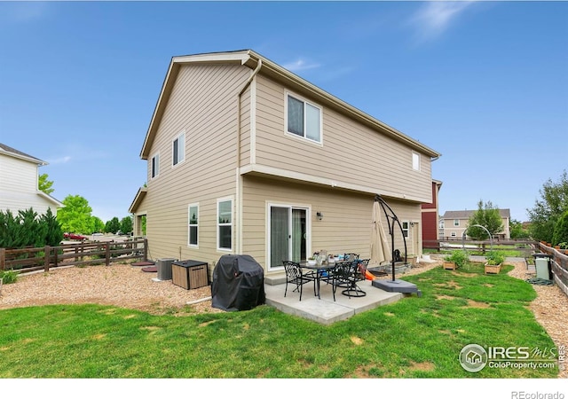 3001 Nebula Ct, Loveland, CO 80537 - back of property with a patio and a fenced backyard