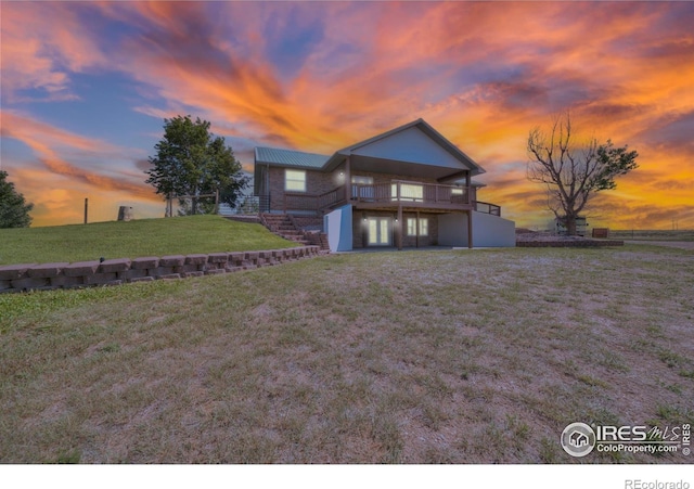 34427 County Rd W, Hillrose, CO 80733 - view of front of property featuring a front lawn, stairs, and a deck
