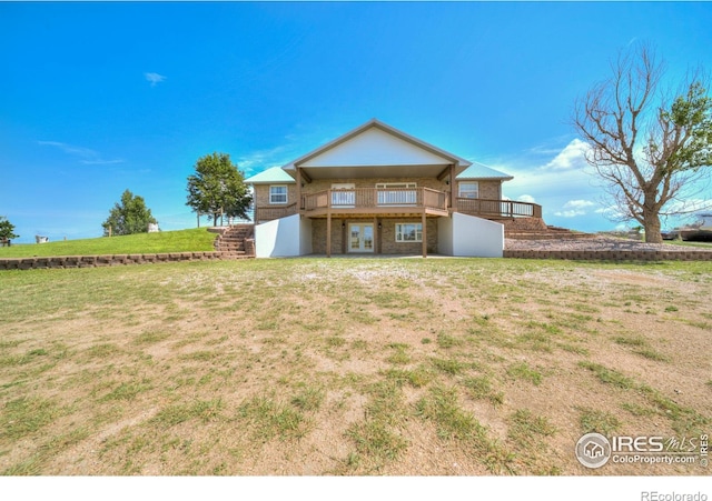 34427 County Rd W, Hillrose, CO 80733 - back of house featuring a yard, stairs, french doors, and brick siding