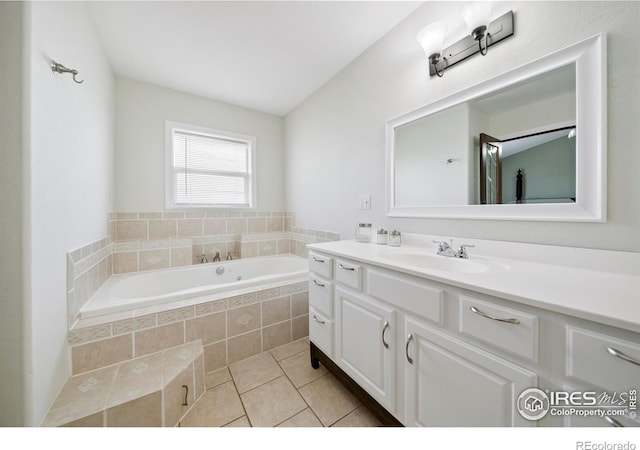 34427 County Rd W, Hillrose, CO 80733 - full bath featuring vanity, a garden tub, and tile patterned floors