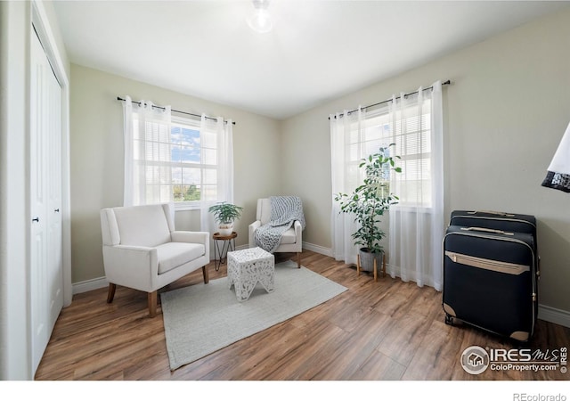 34427 County Rd W, Hillrose, CO 80733 - living area with wood finished floors and baseboards