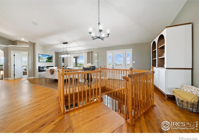 34427 County Rd W, Hillrose, CO 80733 - stairway with a chandelier and wood finished floors