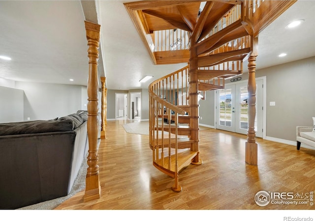 34427 County Rd W, Hillrose, CO 80733 - stairway featuring wood finished floors, recessed lighting, and french doors