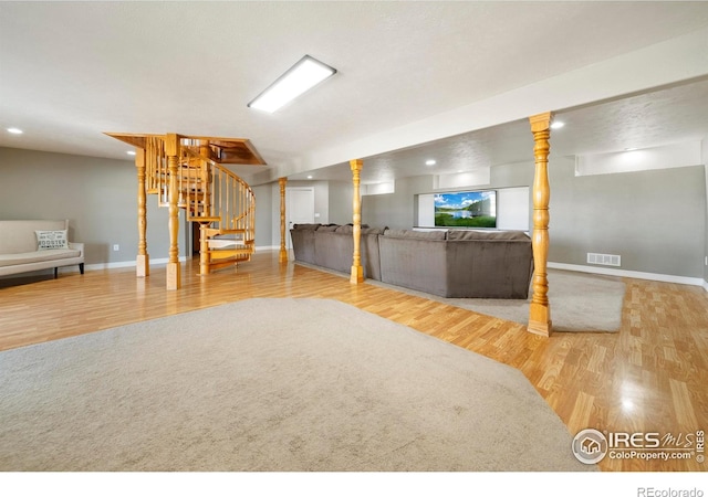 34427 County Rd W, Hillrose, CO 80733 - basement with wood finished floors, stairs, and recessed lighting