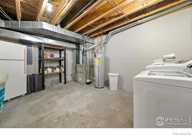 34427 County Rd W, Hillrose, CO 80733 - unfinished below grade area featuring freestanding refrigerator, water heater, washing machine and dryer, and heating unit
