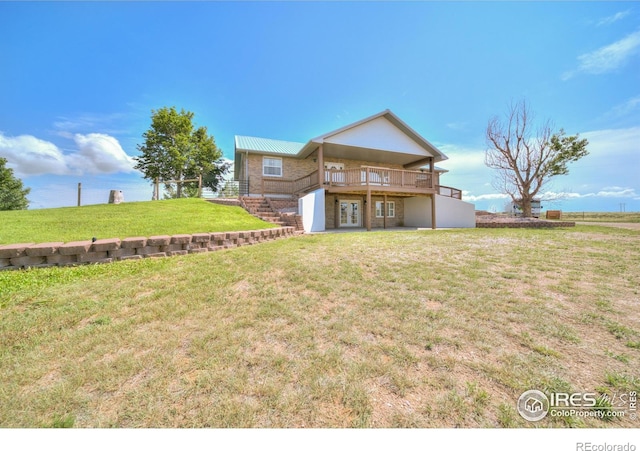 34427 County Rd W, Hillrose, CO 80733 - back of property with stairs, a yard, and a deck