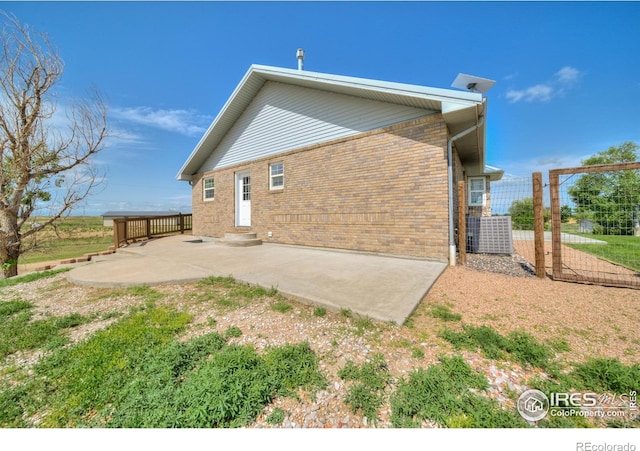 34427 County Rd W, Hillrose, CO 80733 - rear view of house featuring a patio area and brick siding