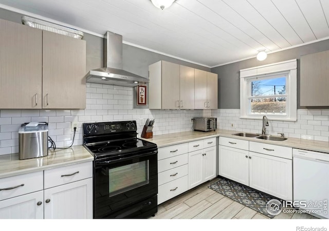 1417 14th St, Greeley, CO 80631 - kitchen featuring wall chimney exhaust hood, black electric range, dishwasher, light countertops, and crown molding