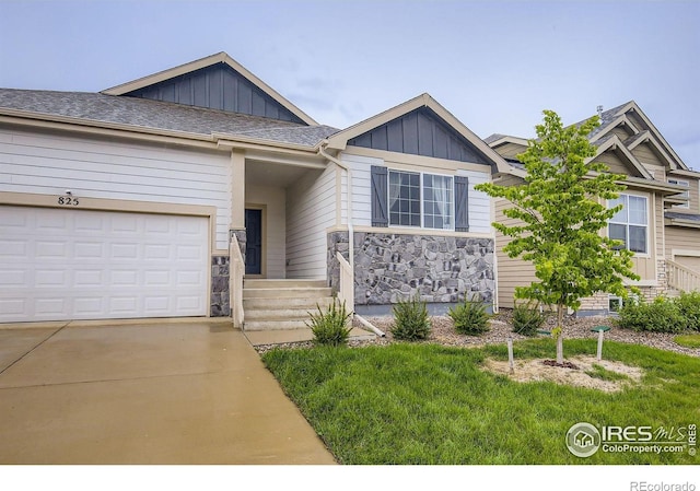 825 Forest Canyon Rd, Severance, CO 80550 - view of front of property with board and batten siding, driveway, stone siding, and a garage