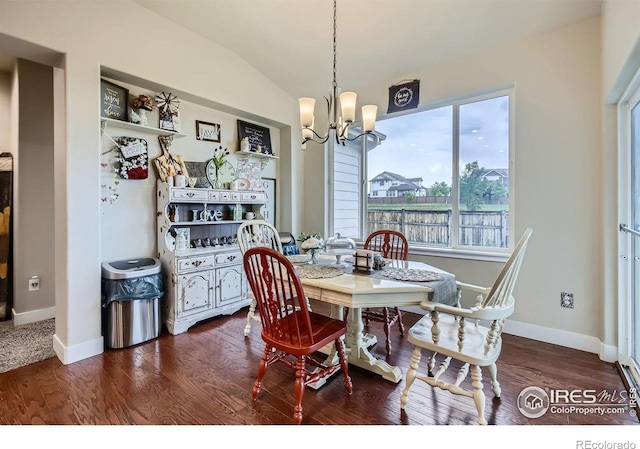 825 Forest Canyon Rd, Severance, CO 80550 - dining area featuring a chandelier, dark wood finished floors, and vaulted ceiling