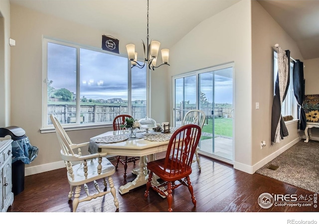 825 Forest Canyon Rd, Severance, CO 80550 - dining area featuring a chandelier, hardwood / wood-style flooring, and lofted ceiling