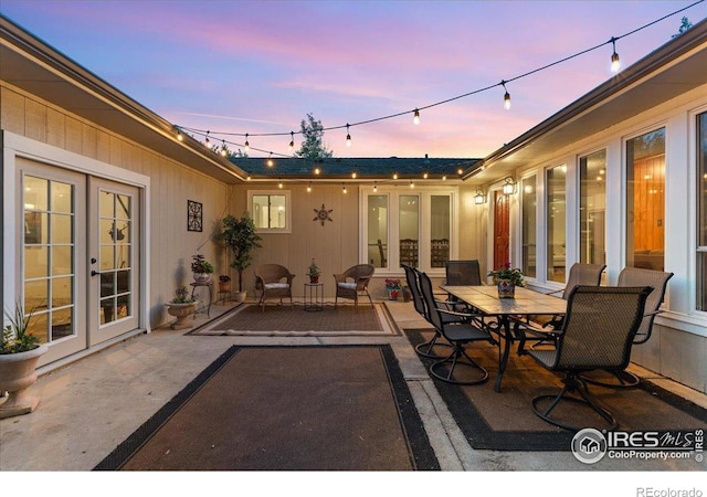 3421 Surrey Ln, Fort Collins, CO 80524 - patio terrace at dusk with french doors and a patio
