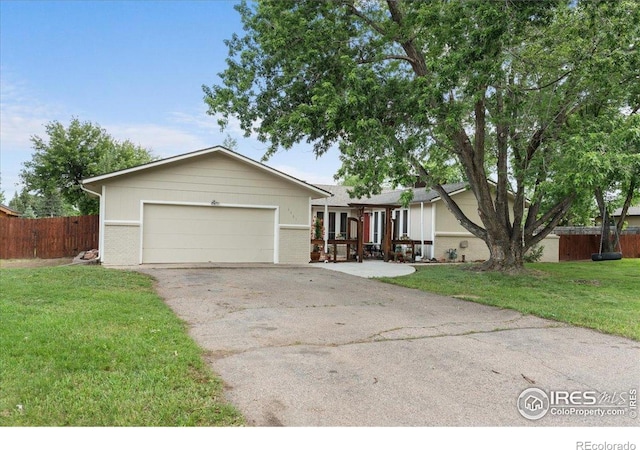 3421 Surrey Ln, Fort Collins, CO 80524 - single story home with asphalt driveway, an attached garage, and brick siding