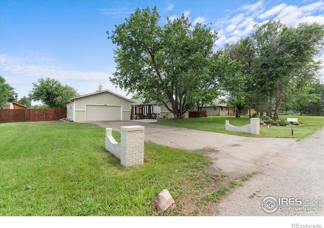 3421 Surrey Ln, Fort Collins, CO 80524 - view of front of home with asphalt driveway and an attached garage