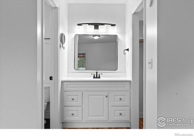 3421 Surrey Ln, Fort Collins, CO 80524 - bathroom featuring toilet and vanity