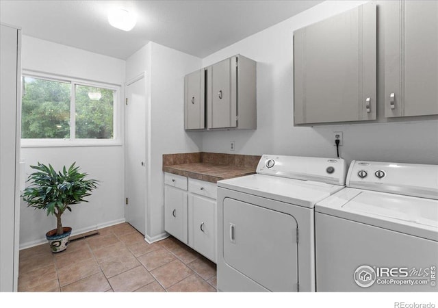 3421 Surrey Ln, Fort Collins, CO 80524 - laundry area with cabinet space and independent washer and dryer