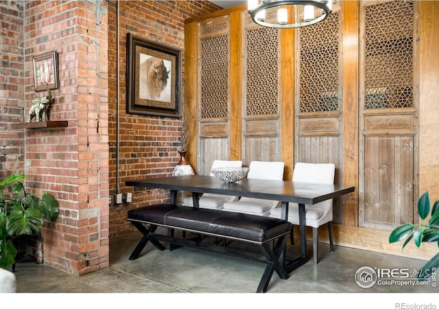 2500 Walnut St Unit 201, Denver, CO 80205 - dining area featuring finished concrete floors and brick wall