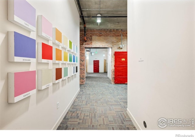2500 Walnut St Unit 201, Denver, CO 80205 - corridor featuring carpet flooring and brick wall