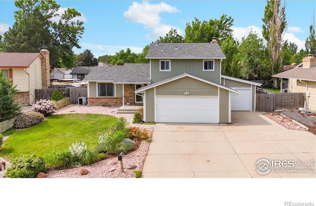4324 W 22nd St, Greeley, CO 80634 - tri-level home featuring a chimney and concrete driveway
