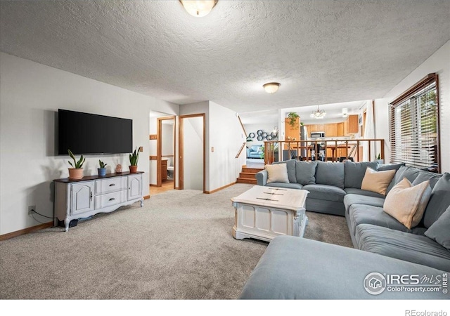 4324 W 22nd St, Greeley, CO 80634 - living area featuring stairs, carpet floors, and a textured ceiling