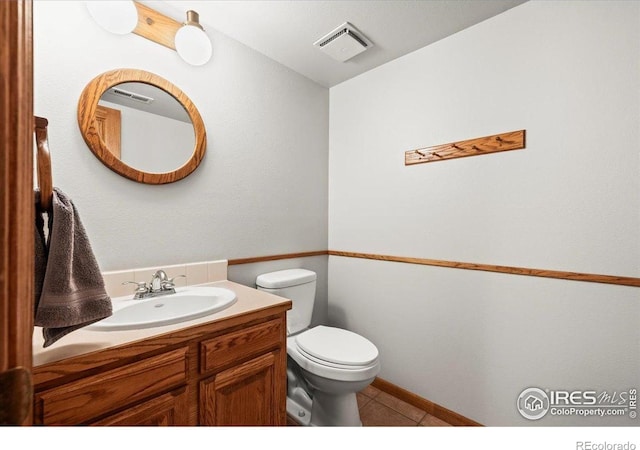 4324 W 22nd St, Greeley, CO 80634 - half bathroom featuring vanity and tile patterned floors