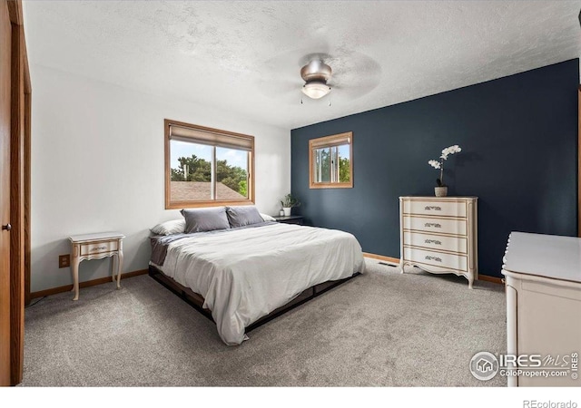 4324 W 22nd St, Greeley, CO 80634 - bedroom with carpet, a textured ceiling, and ceiling fan
