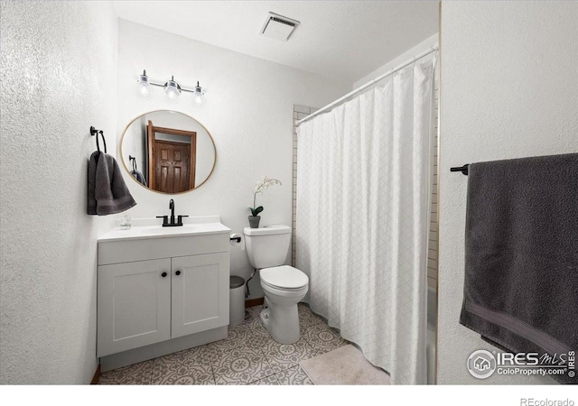 4324 W 22nd St, Greeley, CO 80634 - bathroom featuring vanity, a textured wall, tile patterned flooring, and curtained shower
