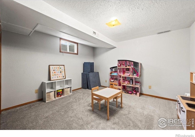 4324 W 22nd St, Greeley, CO 80634 - game room featuring carpet floors and a textured ceiling