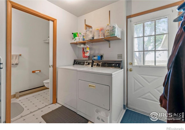 2110 Charro Ave, Longmont, CO 80504 - laundry area with a baseboard radiator, washer and clothes dryer, and light floors