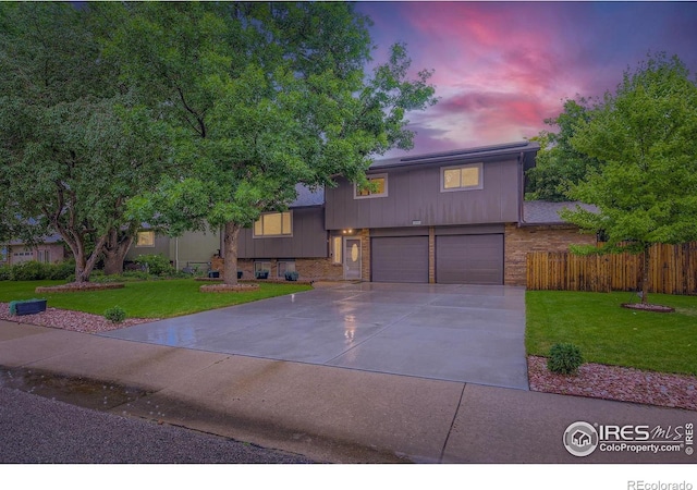 2912 Worthington Ave, Fort Collins, CO 80526 - tri-level home with an attached garage, concrete driveway, and brick siding