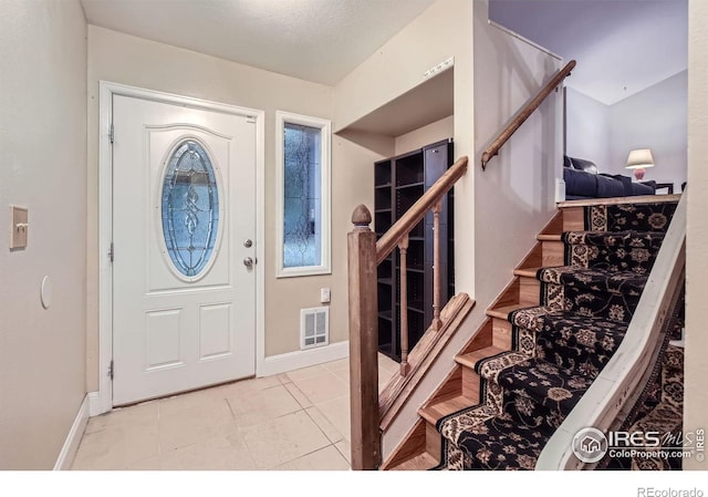 2912 Worthington Ave, Fort Collins, CO 80526 - foyer entrance with stairs and tile patterned floors