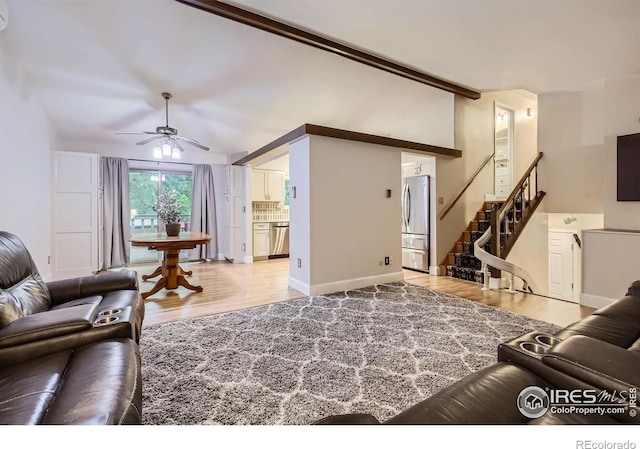 2912 Worthington Ave, Fort Collins, CO 80526 - living room featuring light wood-style floors, ceiling fan, lofted ceiling, and stairs