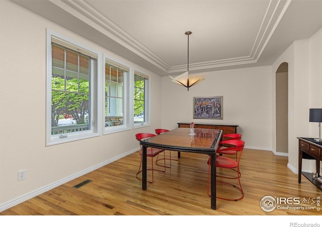 1231 Hawk Ridge Rd, Lafayette, CO 80026 - dining room with arched walkways and light wood-style floors