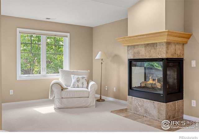 1231 Hawk Ridge Rd, Lafayette, CO 80026 - sitting room with carpet floors and a tiled fireplace