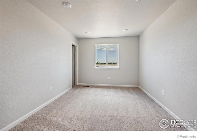 850 Mesic Ln, Windsor, CO 80550 - carpeted empty room with baseboards