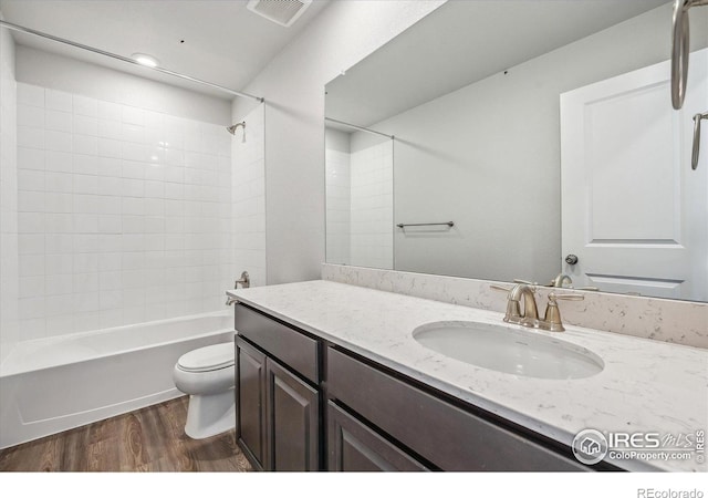 850 Mesic Ln, Windsor, CO 80550 - bathroom featuring wood finished floors, vanity, and  shower combination