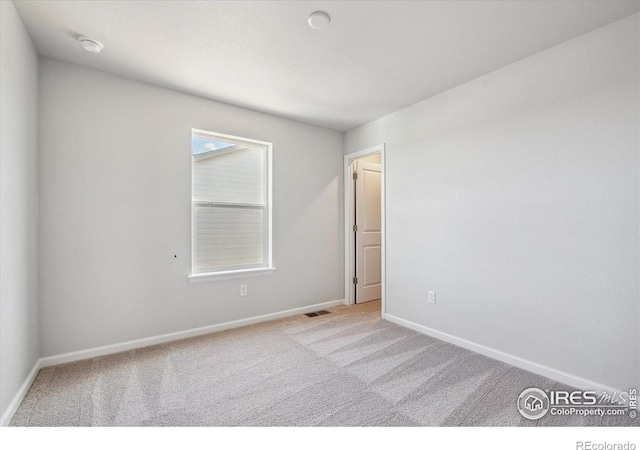 850 Mesic Ln, Windsor, CO 80550 - spare room featuring carpet floors and a smoke detector