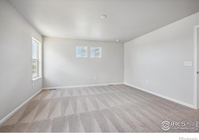 850 Mesic Ln, Windsor, CO 80550 - carpeted spare room featuring plenty of natural light