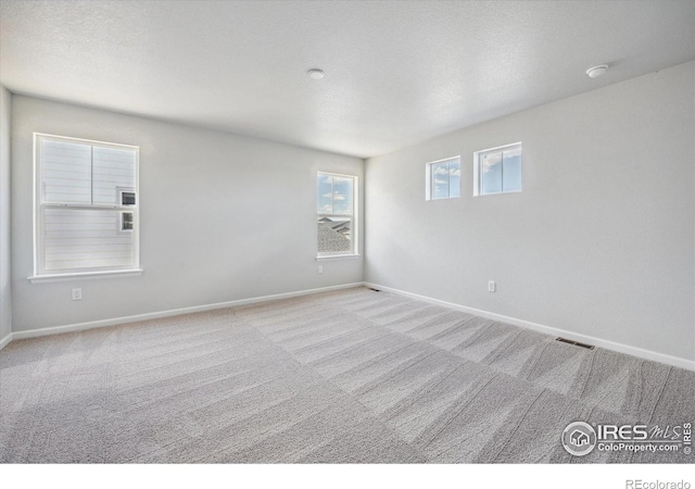 850 Mesic Ln, Windsor, CO 80550 - carpeted spare room featuring baseboards and a smoke detector
