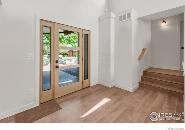 2009 18th Ave, Greeley, CO 80631 - foyer with light wood-type flooring and stairs